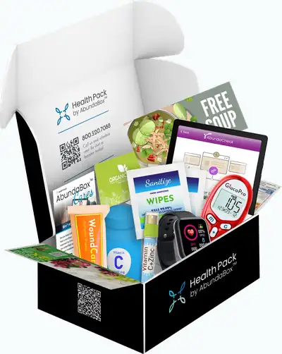 An open AbundaBox HealthPack with wellness supplies and a tablet